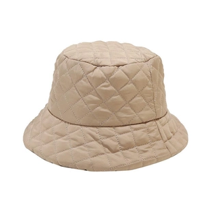 Minimalist beige quilted bucket hat with diamond lattice stitching for autumn warmth