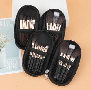 Detail of 9-piece makeup brush set in a black portable zipper case with rose gold ferrules