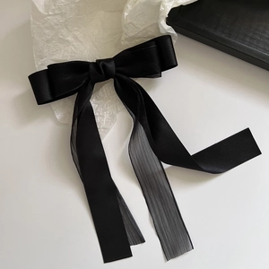 Elegant black silk satin bow hair clip with mesh tulle tails on white background