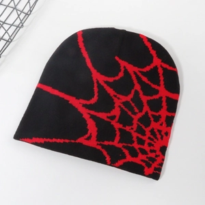 Close-up of black and red knitted spider web jacquard texture on the beanie hat
