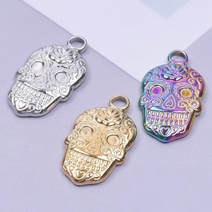Polished stainless steel sugar skull pendants in silver, gold, and iridescent finishes