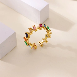 Detail of gold-plated rainbow cubic zirconia ring with rectangular multicolored stones