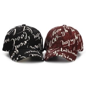 Detail of distressed baseball caps with white script letter prints in black and wine red