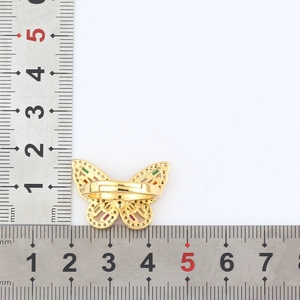 Detailed measurement of a golden butterfly ring with colorful zircons using rulers