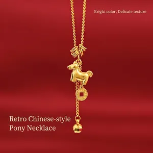 Vertical view of a gold zodiac horse pendant with a coin charm on a red background