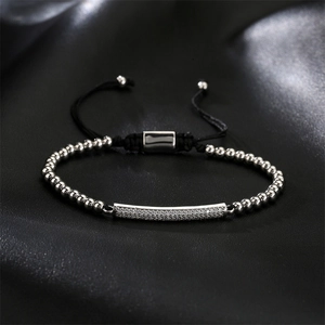 Detail of adjustable beaded bracelet with micro-paved zircon bar and silver beads