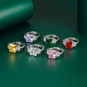 Detailed view of six-piece adjustable ring set featuring emerald cut colored gemstones