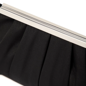 Close-up of pleated black satin evening bag featuring a polished silver metal frame clasp