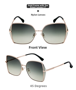 Close-up of golden irregular square sunglasses with gradient green nylon lenses