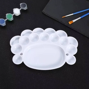 White plastic art palette with 12 wells and large mixing area for watercolor painting