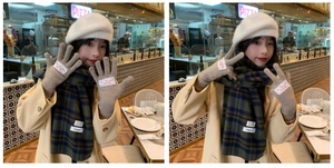 Close-up of beige knitted beret, gloves and blue-green plaid tassel scarf for winter