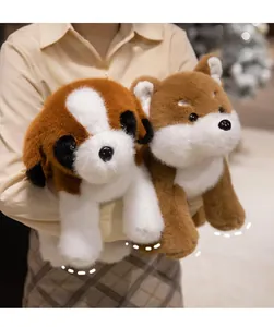 Close-up of fluffy Shiba Inu and Saint Bernard plush toys held by a person in a cozy room