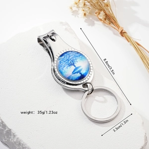 Detailed view of silver bottle opener keychain with tree of life design and measurements
