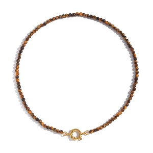 Detail of vintage beaded necklace with tiger eye stones and golden clasp on white background