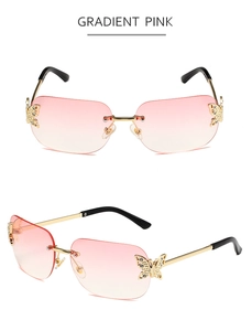 Detail of rimless gradient pink sunglasses with rhinestone butterfly accents and gold temples