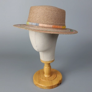Boho flat top straw sun hat with colorful striped brim trim for beach vacations