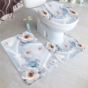 Three-piece floral bathroom set with non-slip mat, U-shaped rug, and toilet lid cover