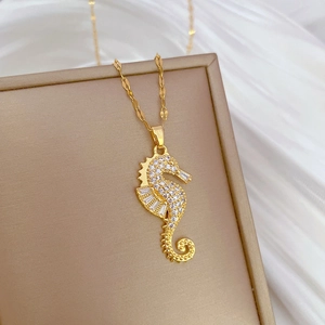 Luxurious gold-plated seahorse necklace encrusted with sparkling cubic zirconia crystals