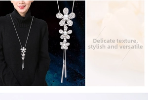 Detail of floral sweater necklace with silver petals, crystals and pearl tassels