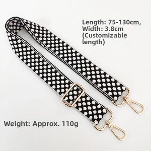 Close-up of 3.8cm wide adjustable knit shoulder strap with gold hooks and geometry pattern