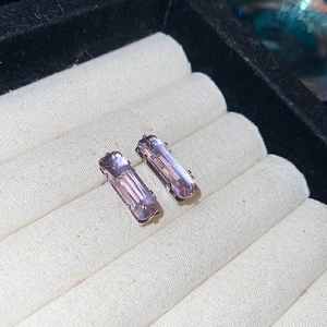 Detailed view of purple rectangular zircon earrings with elegant silver claw setting