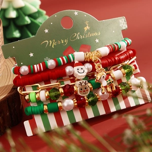 5-piece Christmas beaded bracelet set with Santa and reindeer charms on festive backdrop