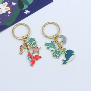 Marine nautical keychains featuring metal seahorse jellyfish and shark pendants in gold finish