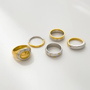 Two-tone titanium steel ring set in gold and silver with minimalist geometric designs