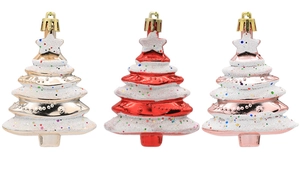 Detailed view of red, gold, and rose gold Christmas tree ornaments with glitter finish