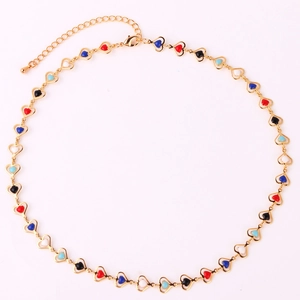 Detail of gold chain necklace featuring colorful enamel heart pendants and lobster clasp