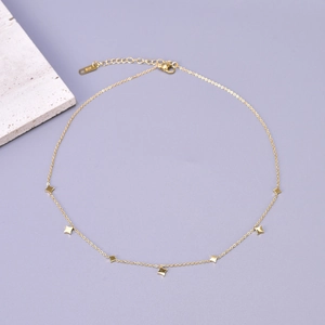 Detail of 18K gold-plated stainless steel star necklace with lobster clasp and extender