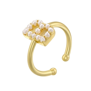 Detail of elegant gold-plated ring featuring a pearl-encrusted letter D design
