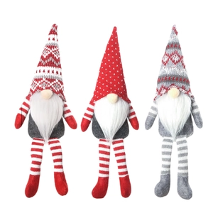 Three Nordic Christmas gnomes with long legs in red, grey and white colors