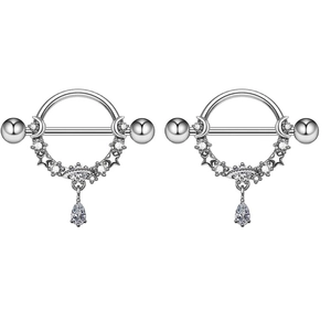 Detailed macro view of butterfly nipple shields with crescent moon and star zircon pendants