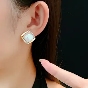 Elegant square gold earrings with iridescent mother-of-pearl and crystal accents