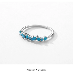 Macro detail of S925 sterling silver ring with turquoise stones in marquise cut