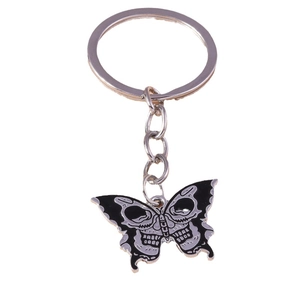 Gothic black butterfly keychain featuring white skull bone patterns on a white background