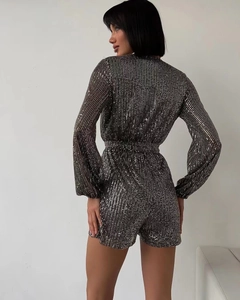 Back view of a long sleeve sequined romper with high density metallic glitter fabric