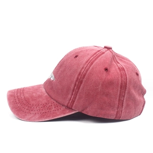 Vintage washed cotton baseball cap in deep pink featuring minimalist white embroidery