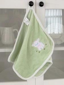 Detail of soft green microfiber bath towel featuring cute lamb embroidery and rope piping