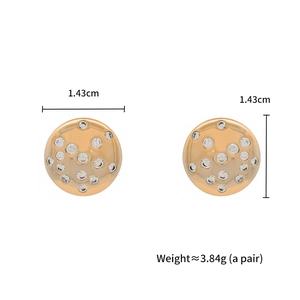 Detailed view of gold round stud earrings with clear crystals measuring 1.43cm in diameter