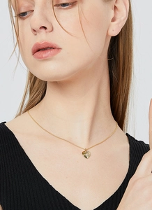 Golden heart necklace featuring a hollow engraved pendant on a delicate metal chain