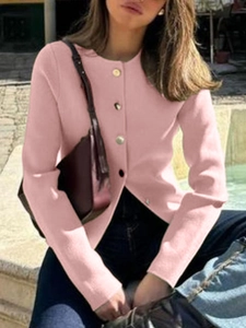 Outdoor street style view of pink knit long sleeve button-up cardigan for women