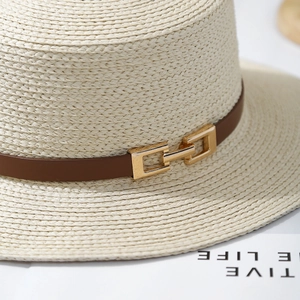 French boater straw hat with light beige weave, brown leather band and gold buckle