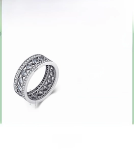 Detail of 925 sterling silver hollow lattice ring with sparkling cubic zirconia stones