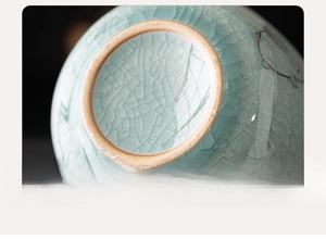 Macro detail of ice-cracked glaze ceramic jar with hand-painted rabbit and polished base