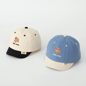Close-up of teddy bear embroidery and premium cotton texture on kids baseball cap