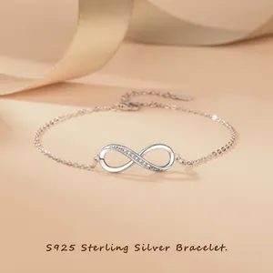 Detail of S925 sterling silver infinity bracelet featuring sparkling inlaid zircons