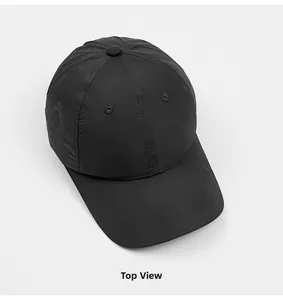 Top-down view of a black quick-dry baseball cap with breathable vents and reinforced brim