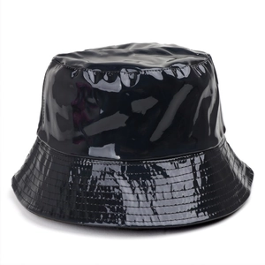 Detail of shiny black PU leather bucket hat with precise multi-row stitching on the brim